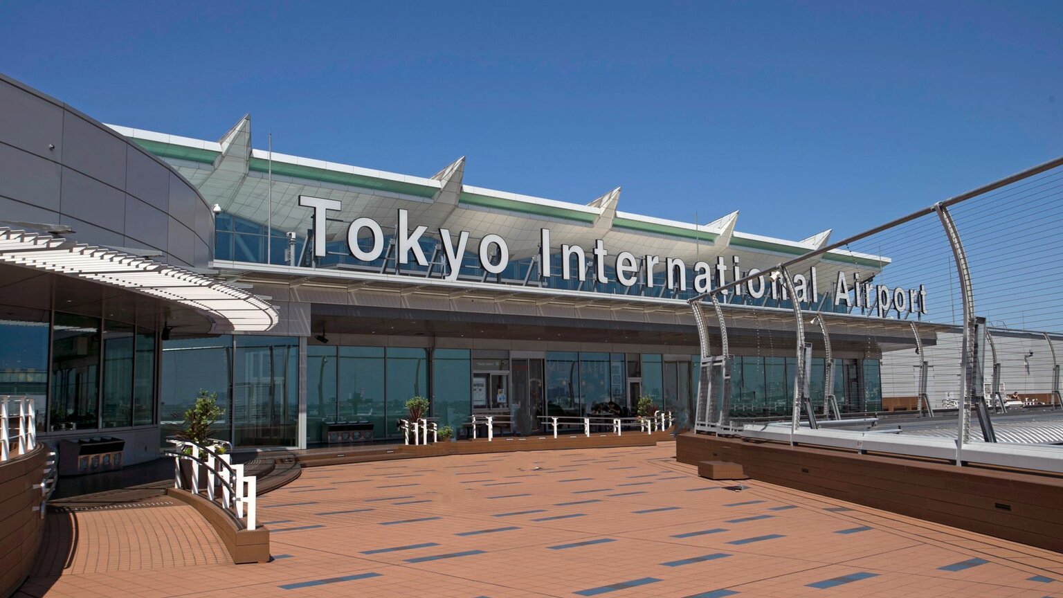 The rooftop observation deck of a Haneda Airport terminal, with Tokyo International Airport written on the roof